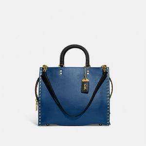 Coach Purse Rogue Beautiful Blue hand crafted leather with gold rivets.
